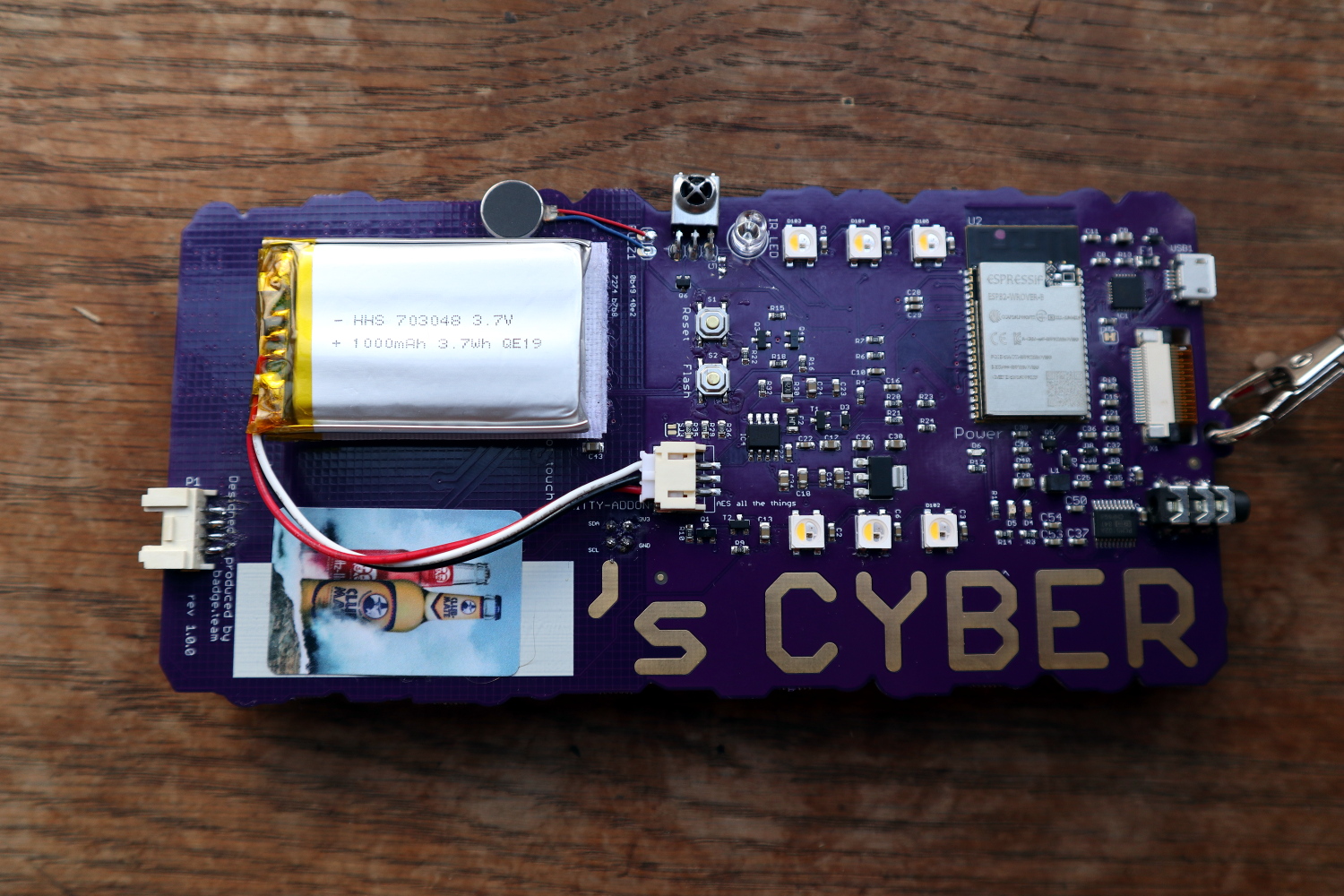 The rear of the Hacker Hotel 2019 badge, showing the vibration motor and IR components at top centre. The Club-Mate RFID sticker is not a standard fitment!