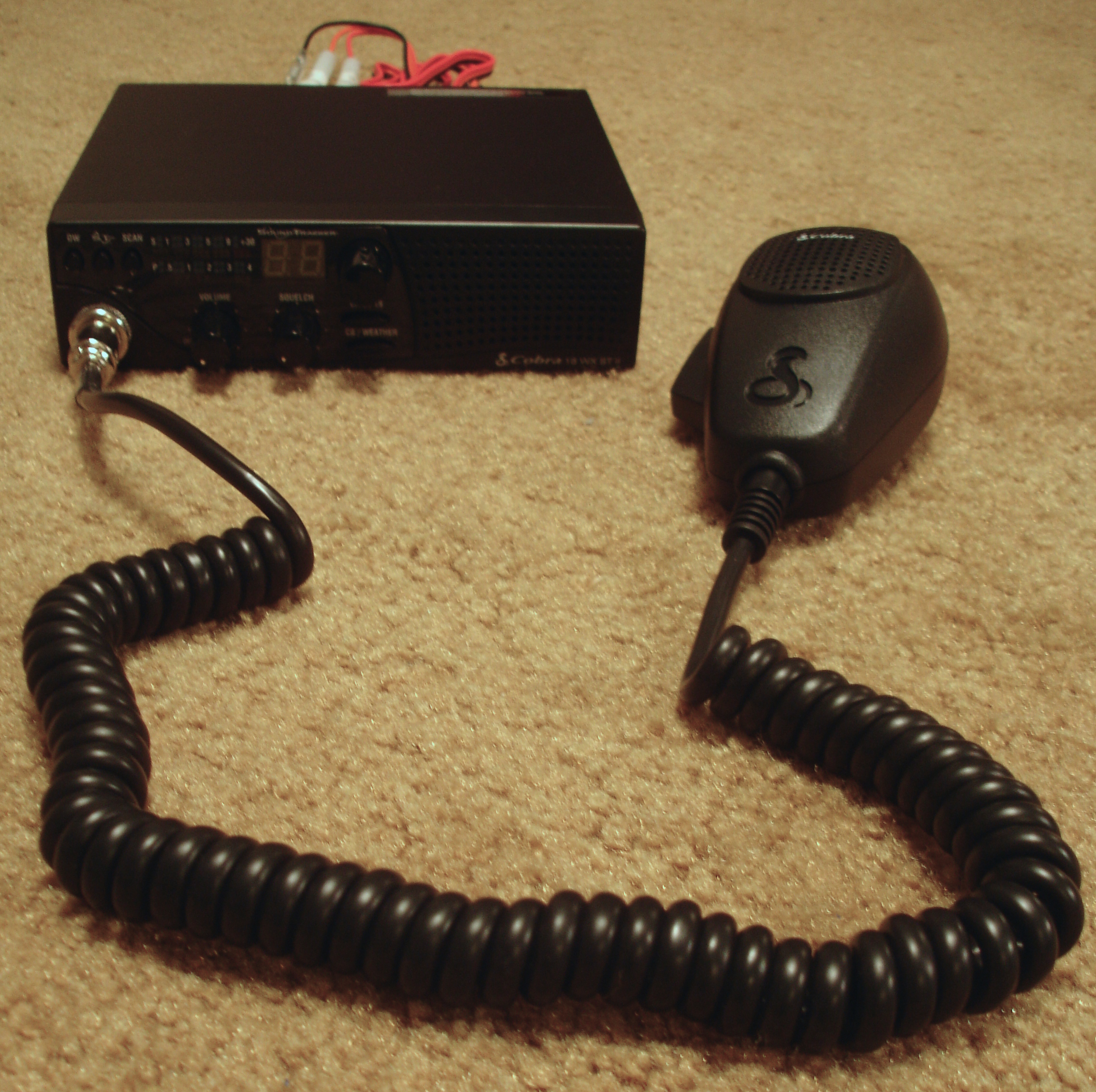 Cobra 18 WX ST II mobile Citizens' band radio, with a toggle to receive NOAA Weather Radio All Hazards, scanning the CB band, and a toggle for Channels 9 and 19. (Credit: Zuzu, Wikimedia Commons)