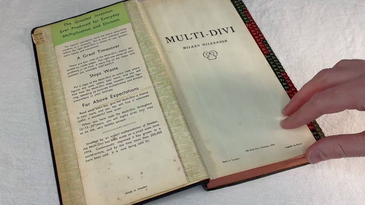 Multi-Divi book with hand thumbing through it