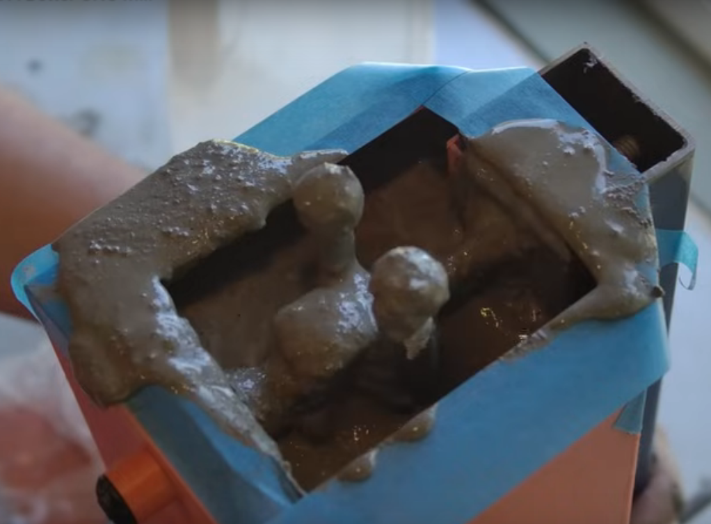 An image of the main column of [Chris]'s CNC mill as the concrete is added. The steel reinforcement is clearly visible.