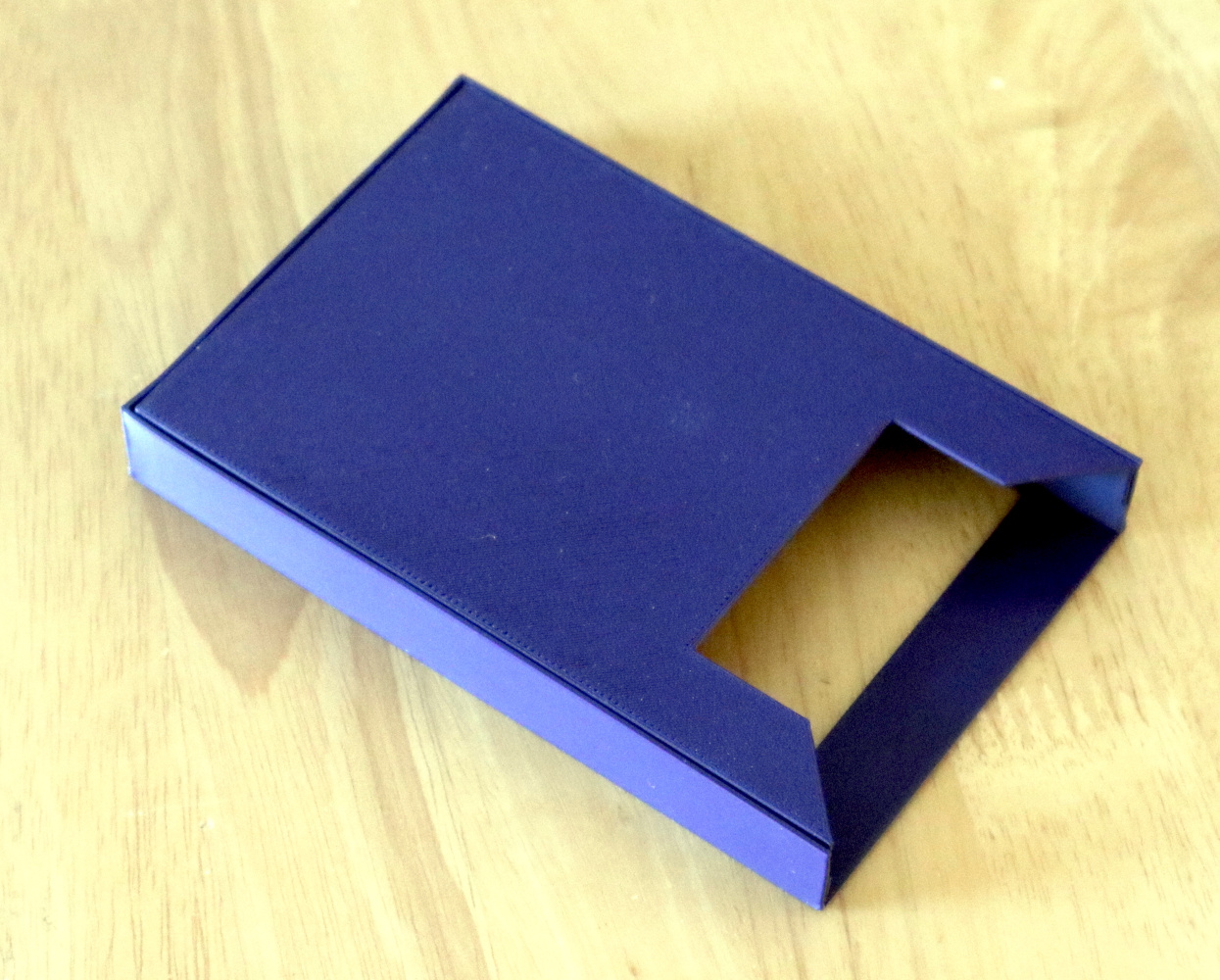 A rectangular 3d printed box about 90mm wide and 100 mm long.