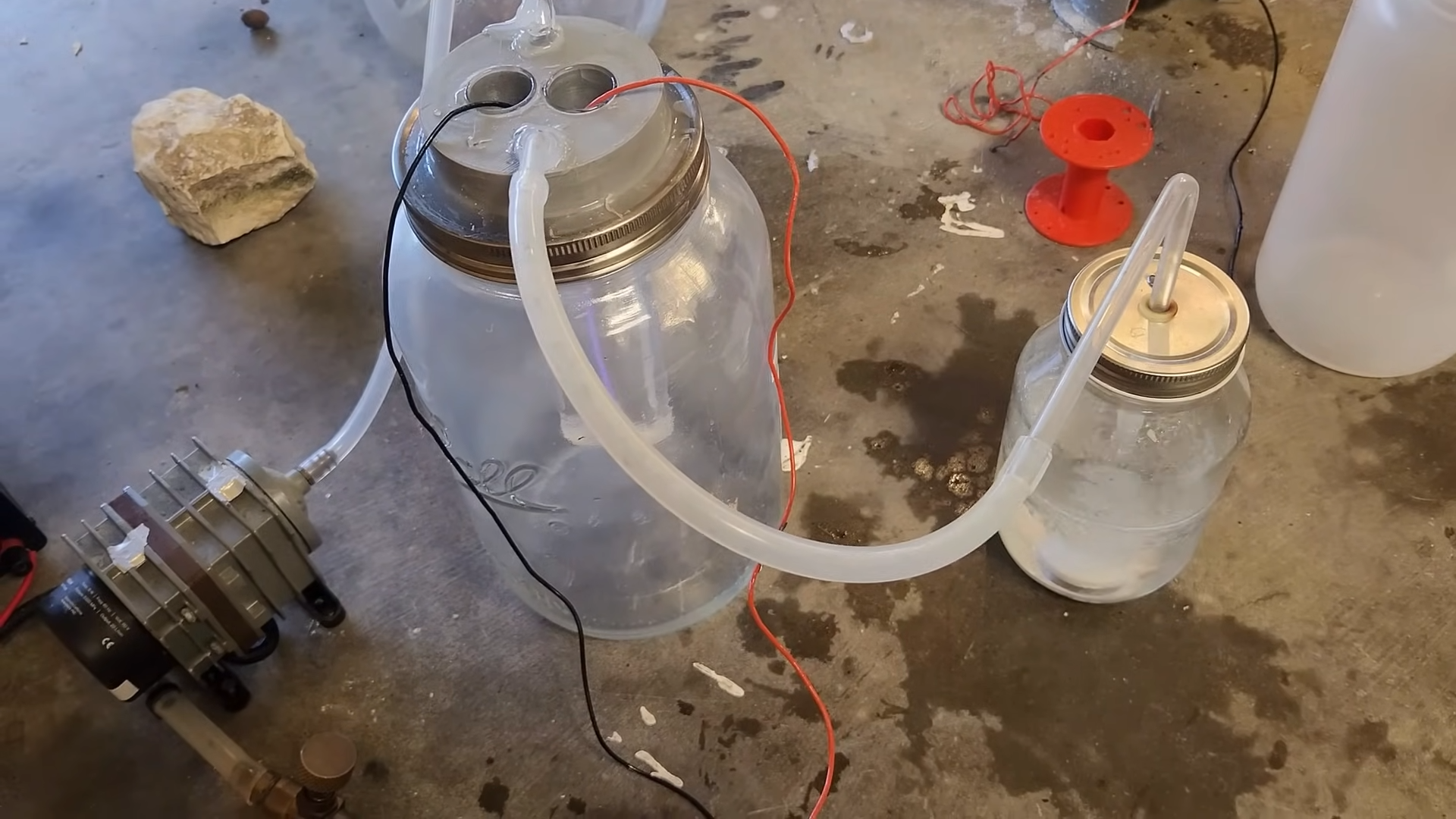 Experimental setup with two mason jars hooked up from ozone production to nitrate