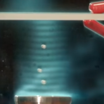 Standing waves in an ultrasonic levitation device, visualized.