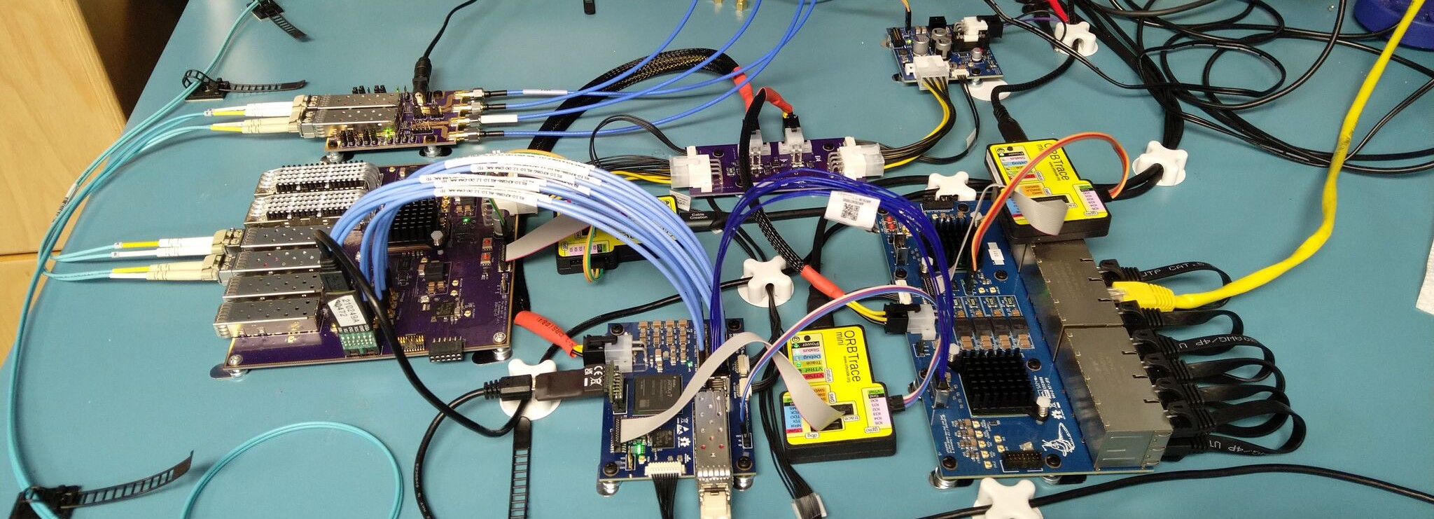 Various hardware components laid out on a workbench.