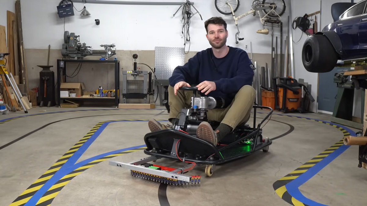 [Austin Blake] sitting on line follower cart in garage
