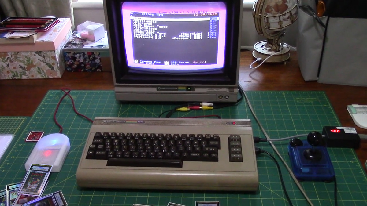 C64 on desk with NFC TeensyROM and game token