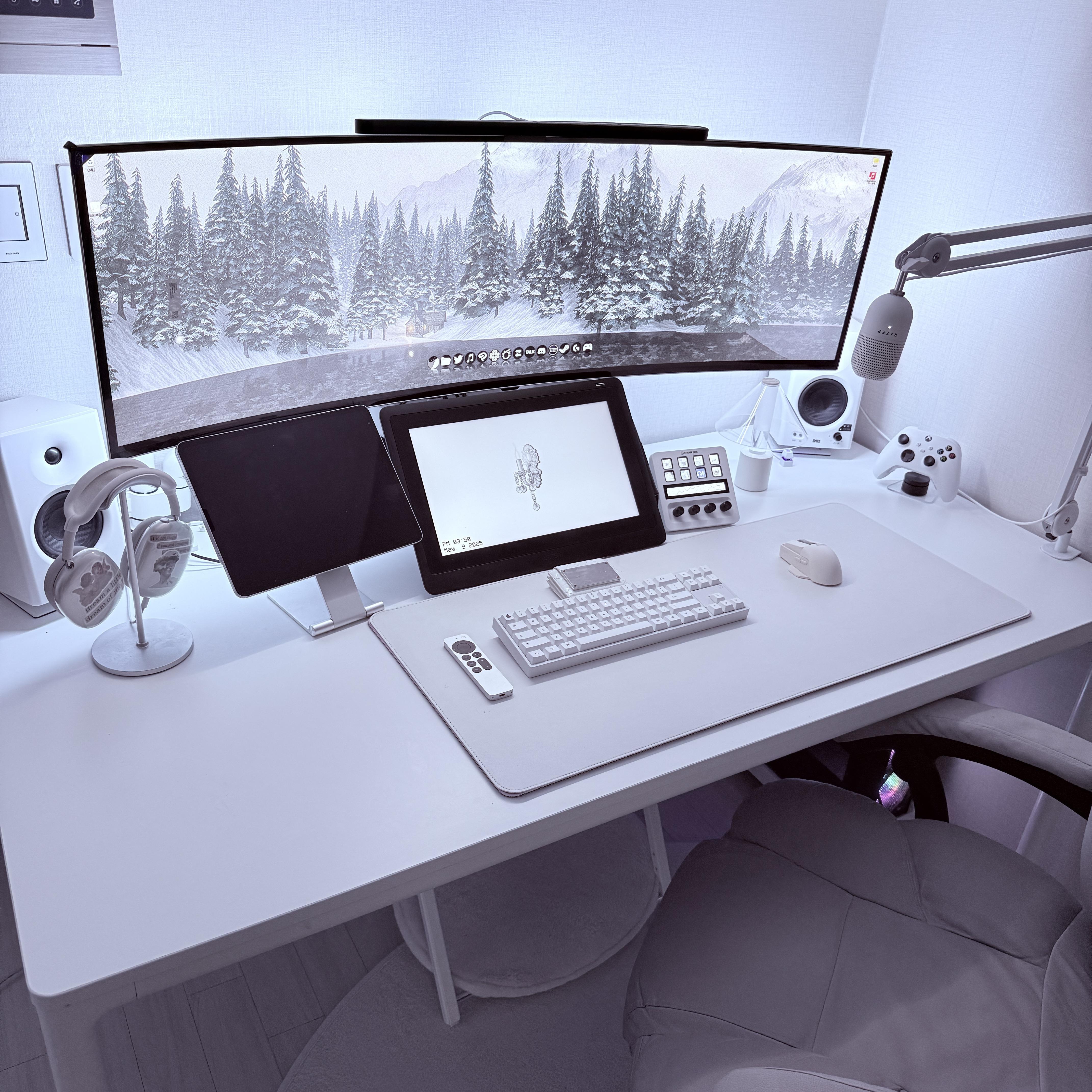 A mostly-white setup with a wiiiiide monitor.