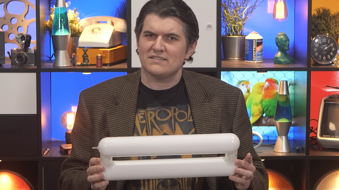 Presenter holds an induction lamp bulb