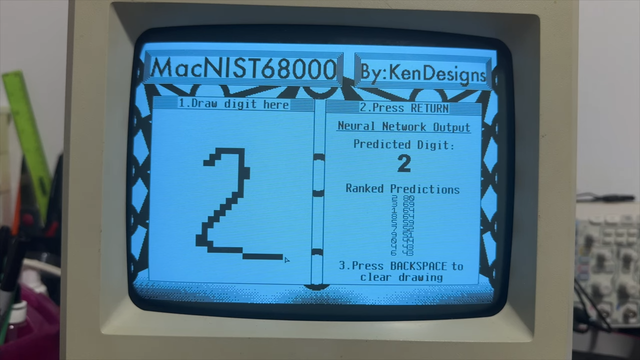 Neural network shown on original mac screen, handwritten 2 on left and predictions on right
