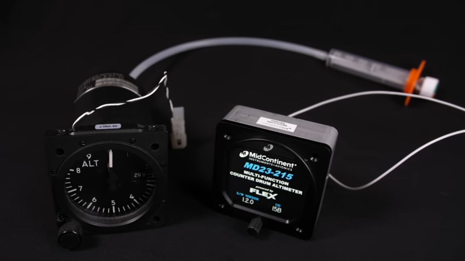A photo of the old mechanical and new digital altimeters