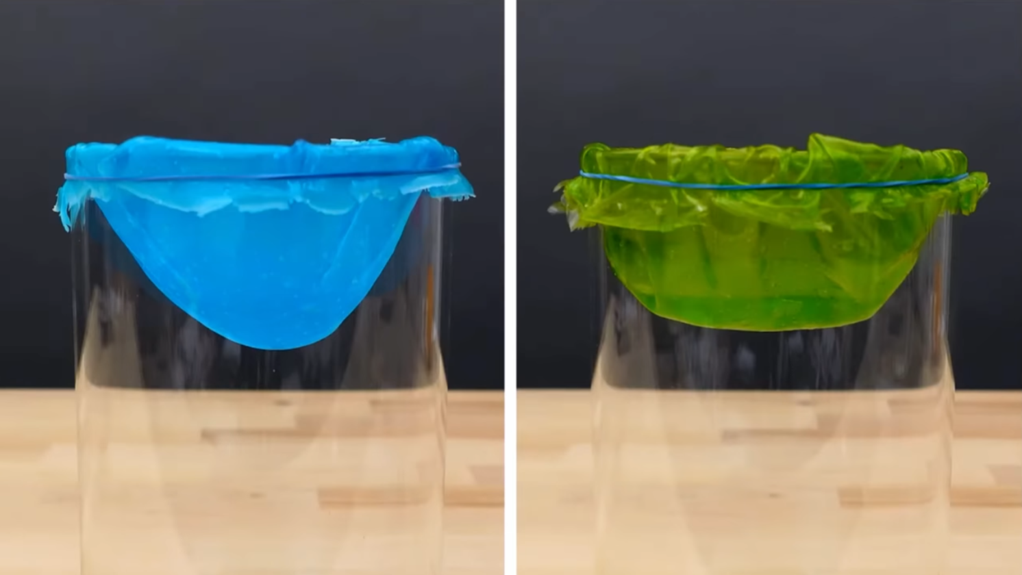 Two colored plastic films are loosely tied over the entrances to two plastic containers.