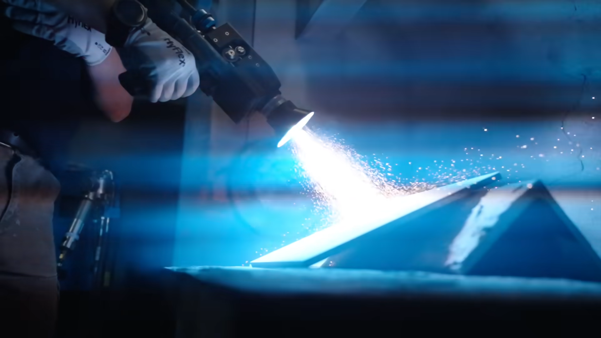 Alec using the arc spraying device