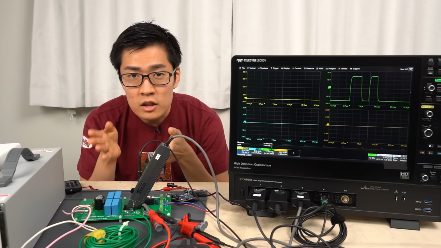 Photo of [DENKI OTAKU] with his test circuit and oscilloscope