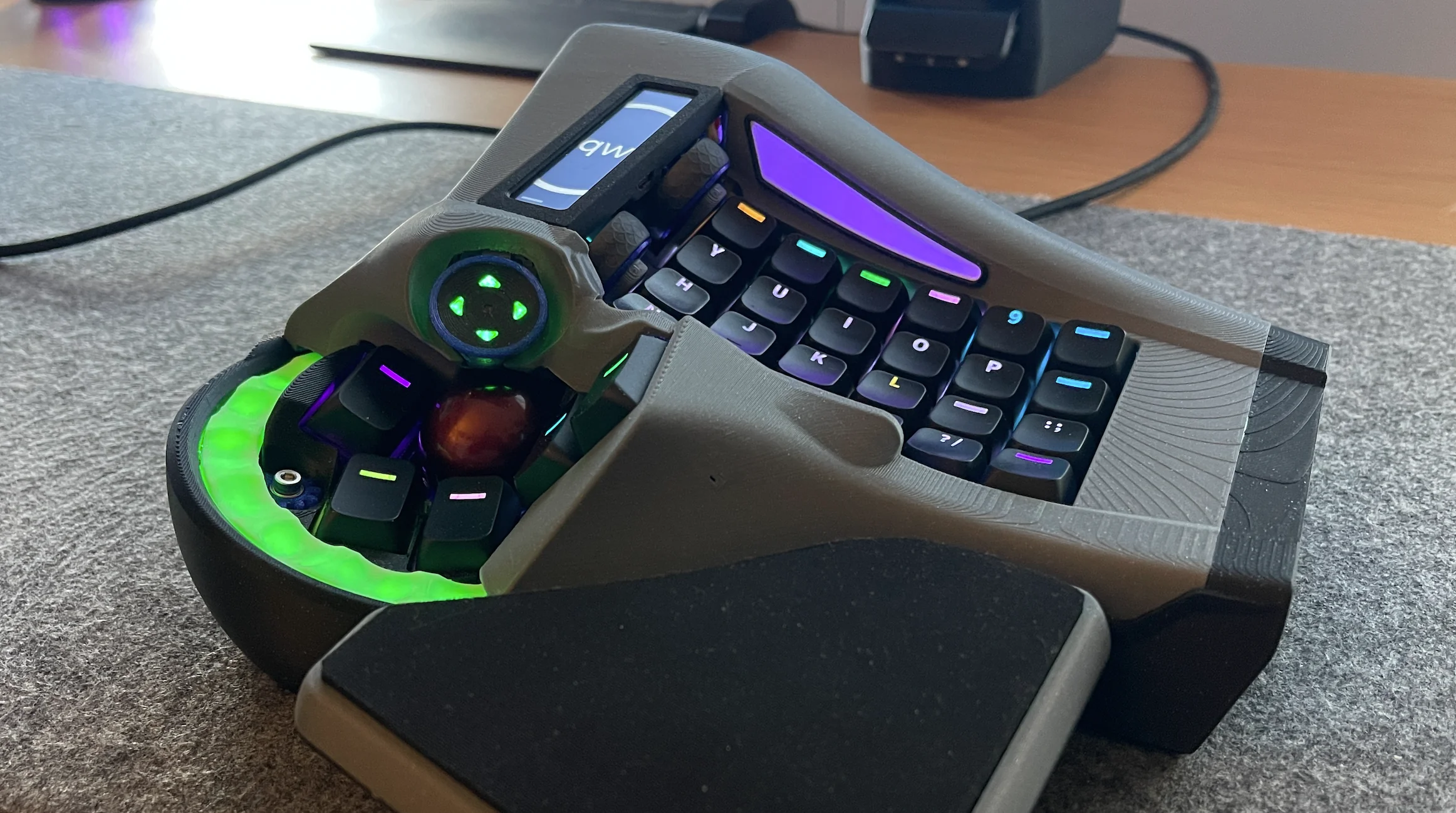 The right half of a split keyboard with integrated mouse control out the wazoo.