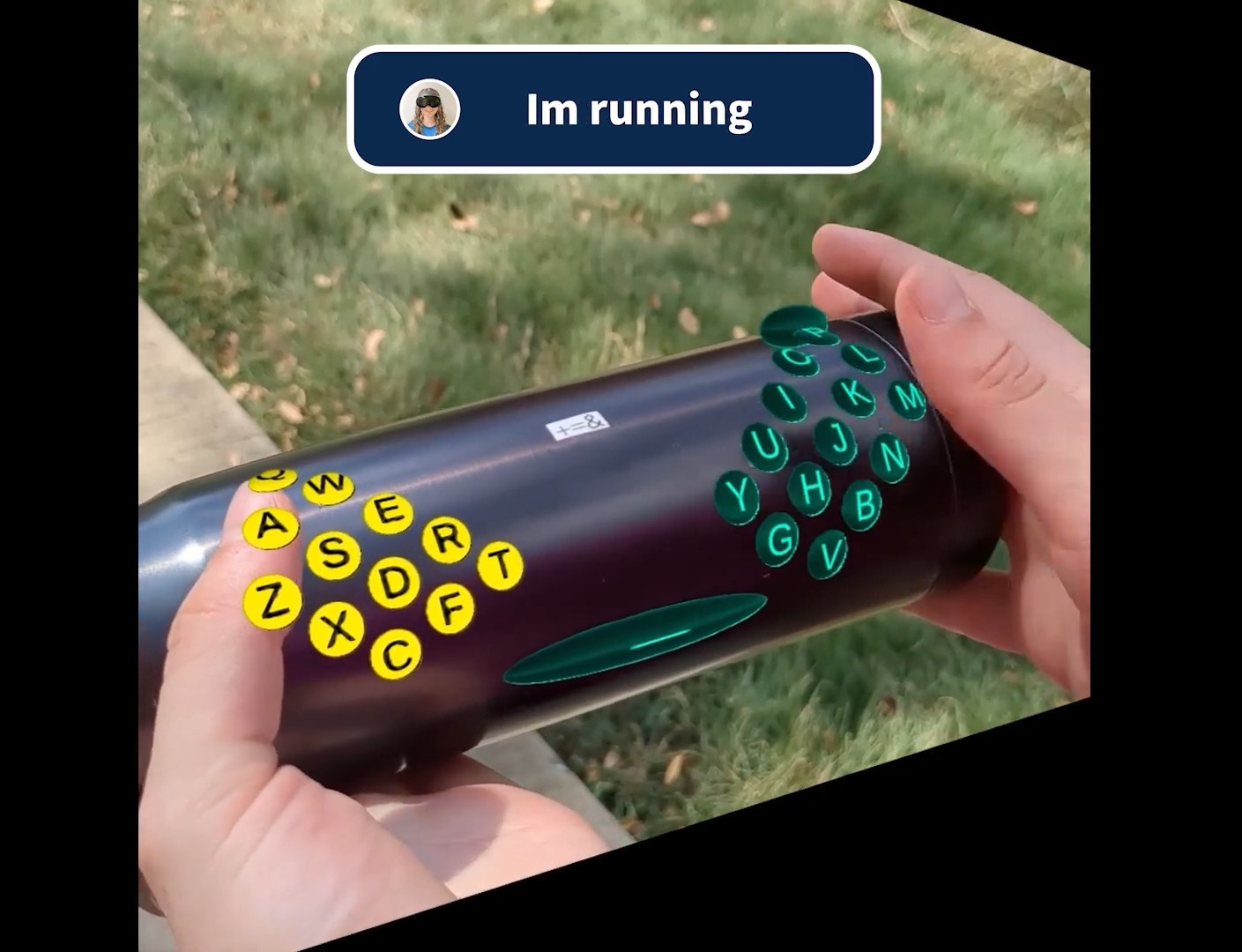 A split keyboard is projected onto a water bottle.