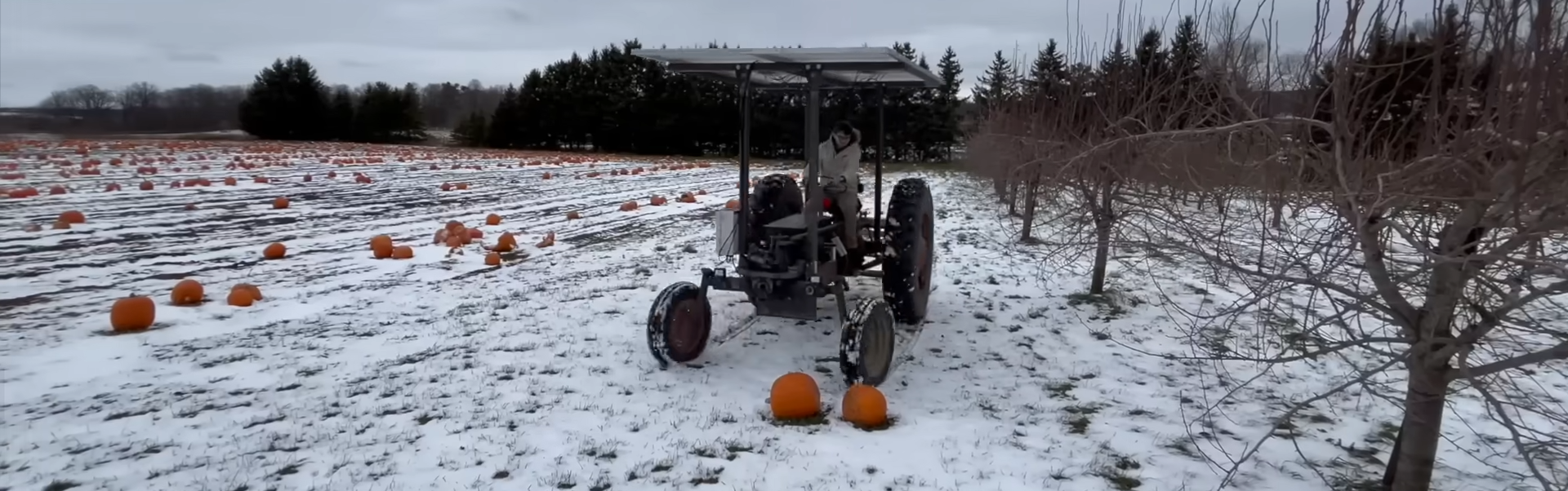 The solar-electric tractor is out standing in its field.