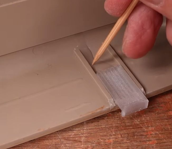Using UV resin as glue for new case clips. (Credit: More Fun Making It, YouTube)