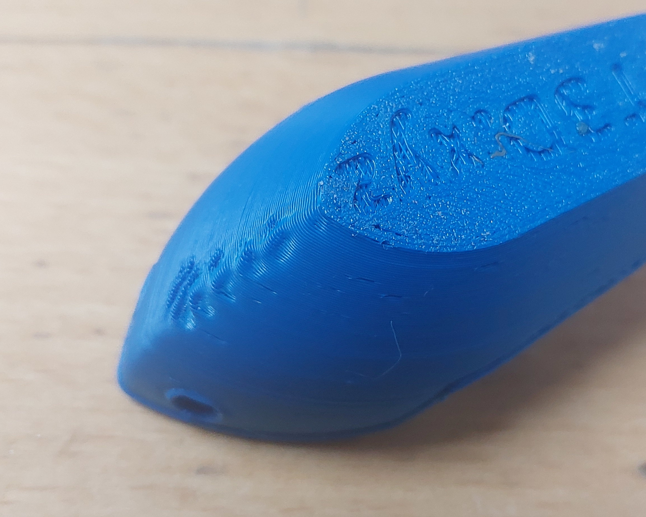 The prov of a Benchy 3D printer test, with visible droop.