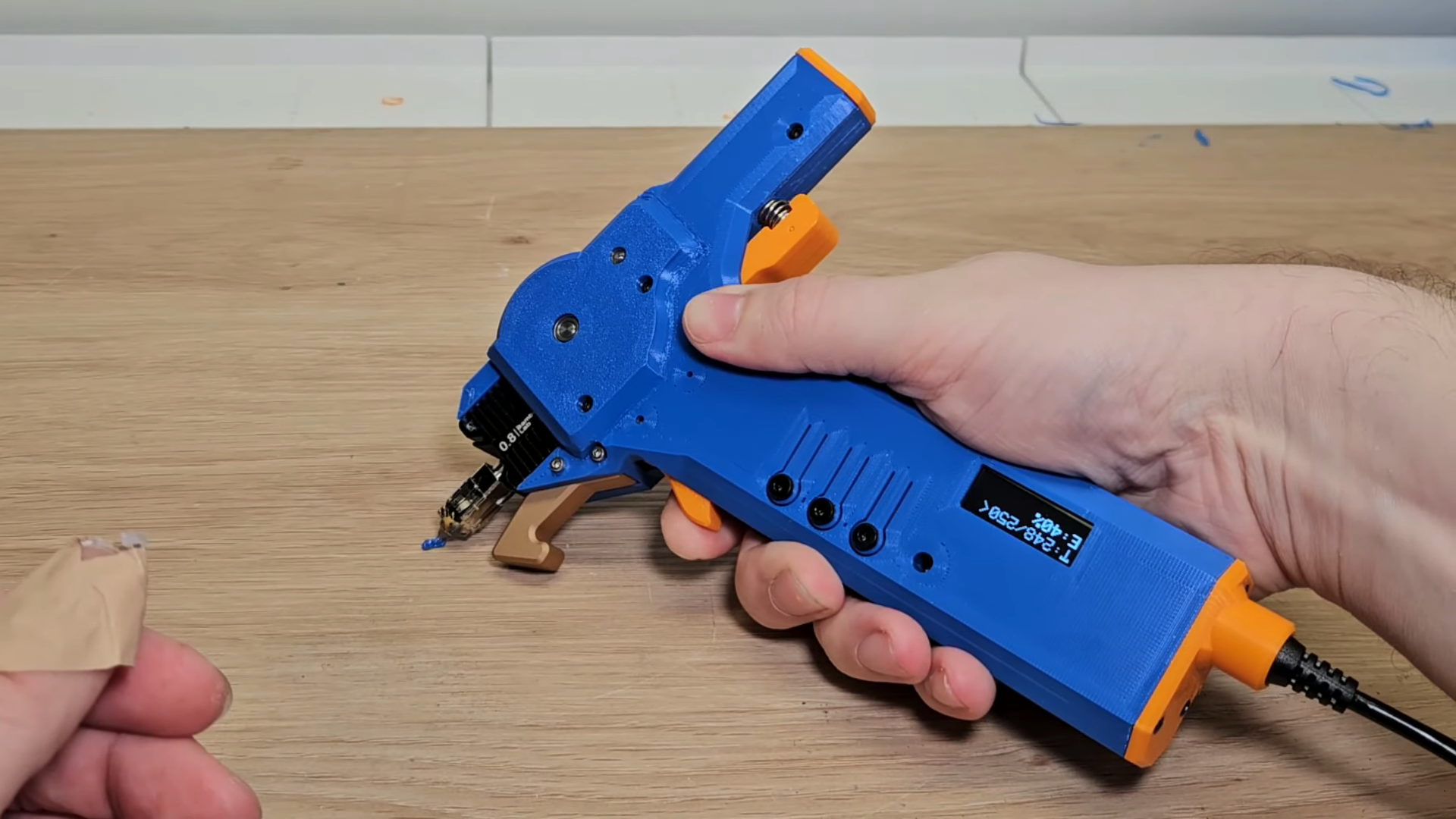 The printer-based "pen" has a pistol form factor.