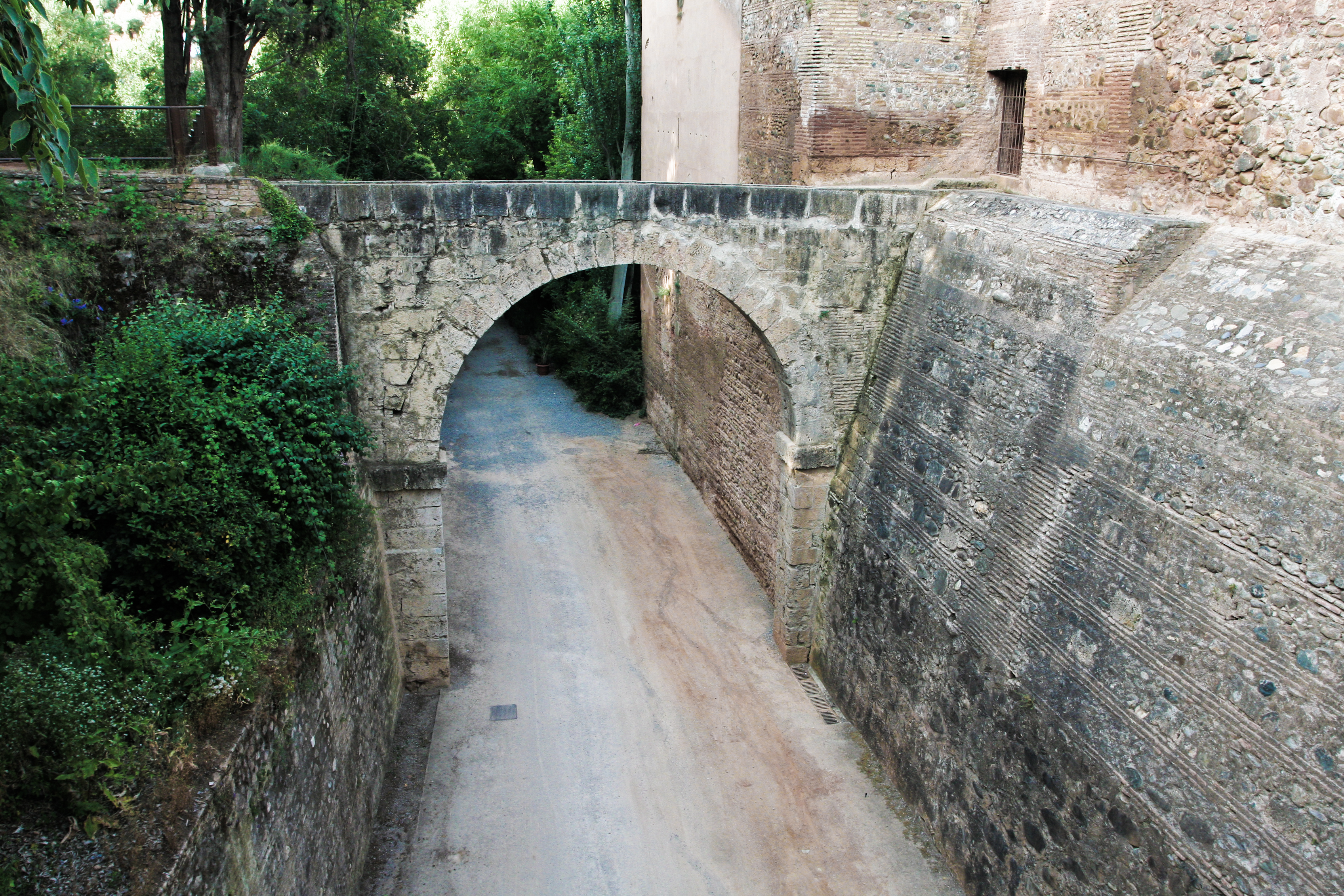Aqueduct of the Alhambra as it enters the wall. (Credit: Sharon Mollerus, Wikimedia)