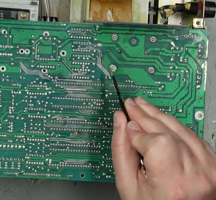 Some PCB corrosion on the bottom of the 1541 drive. (Credit: TheRetroChannel, YouTube)