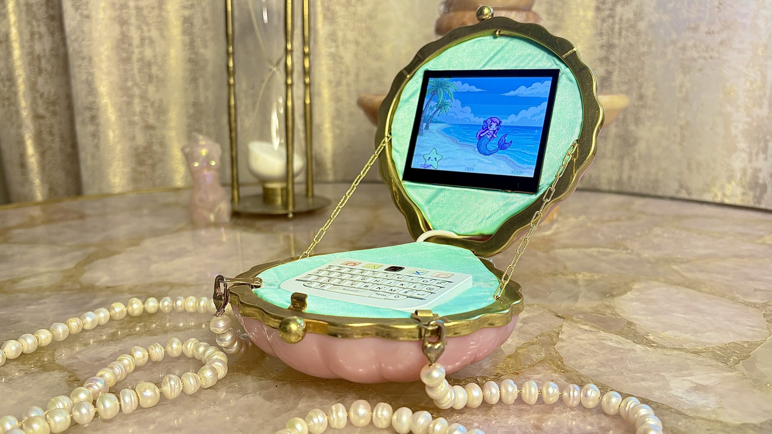 The clutch-purse cyberdeck, complete with pearls for the chain.